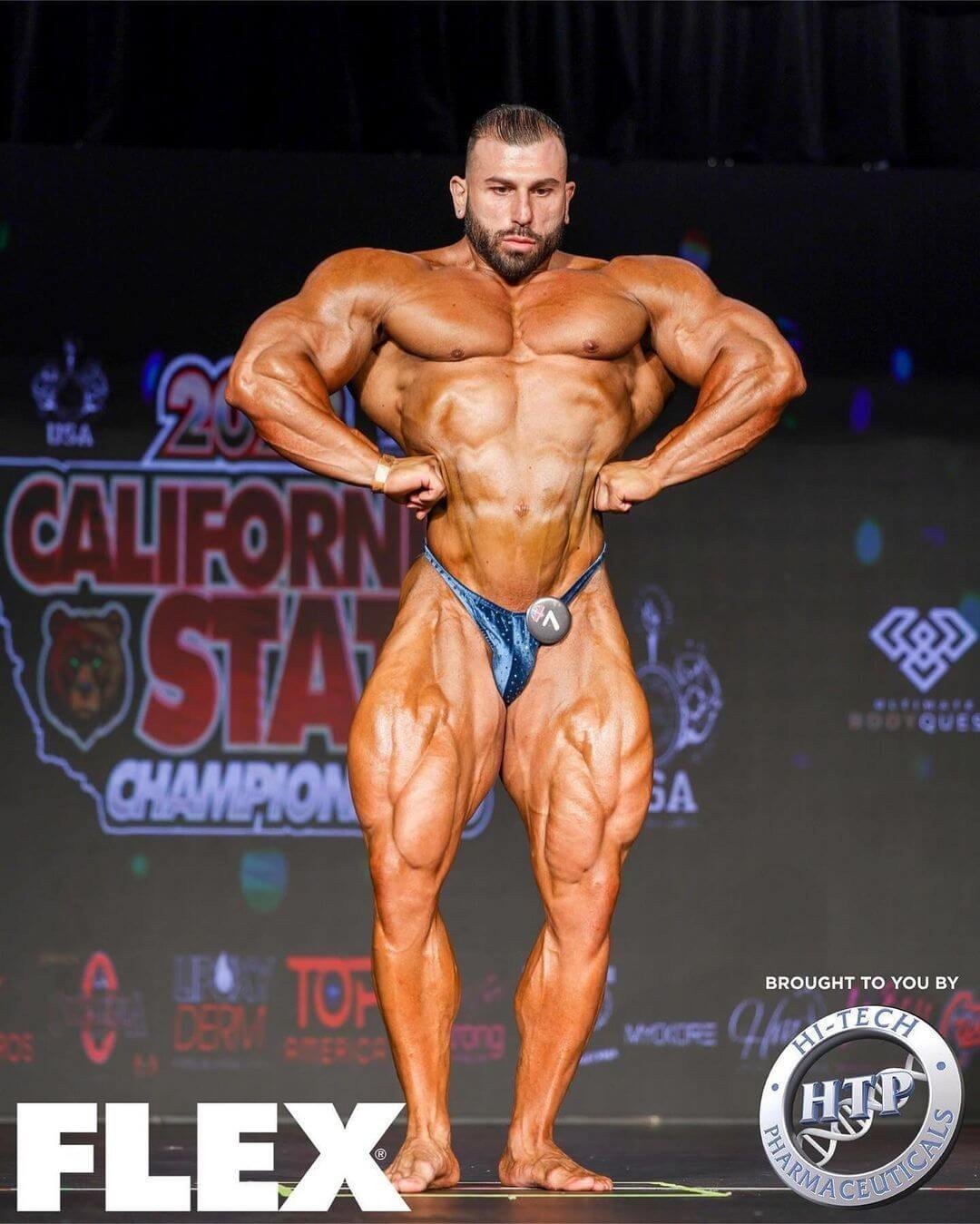 Andrea Muzi performing a front lat spread at the 2022 California State Pro