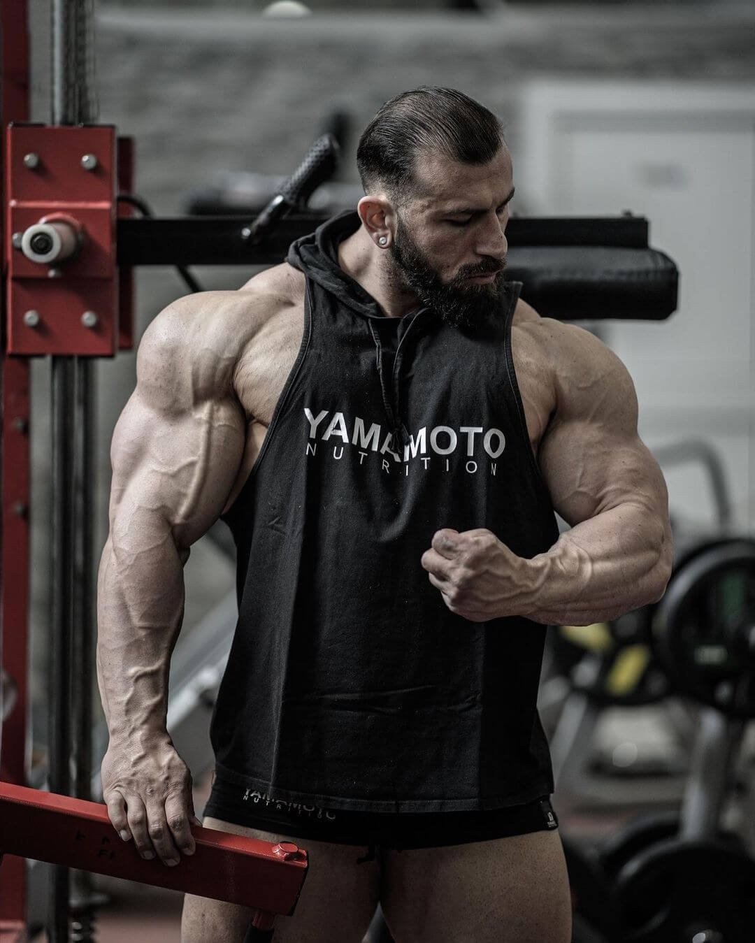 Andrea Muzi training in the gym wearing a Yamamoto Nutrition top