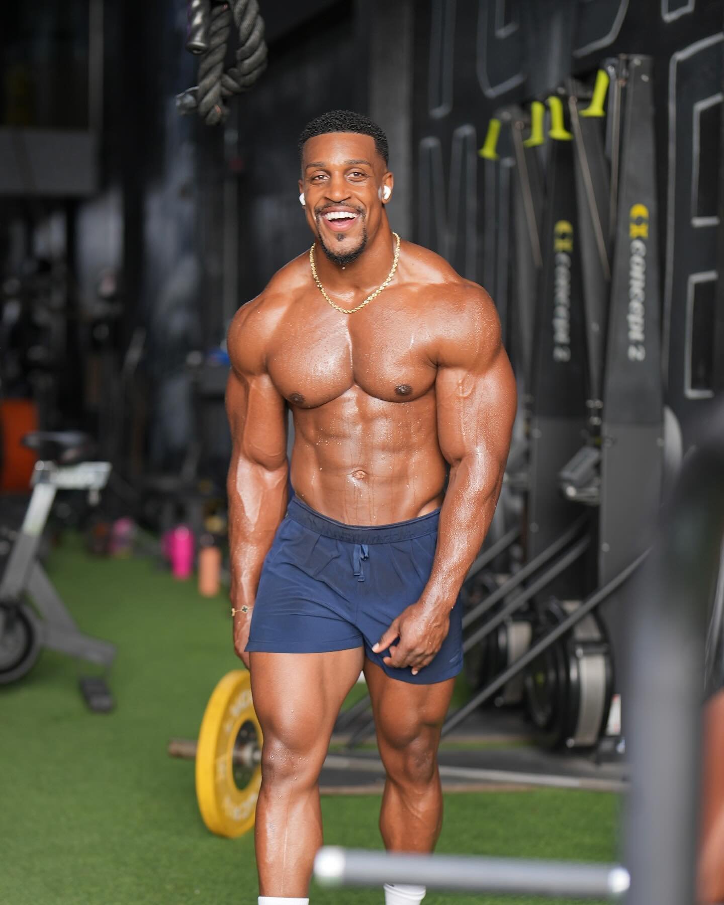 Ashton Hall smiling in the gym after a workout