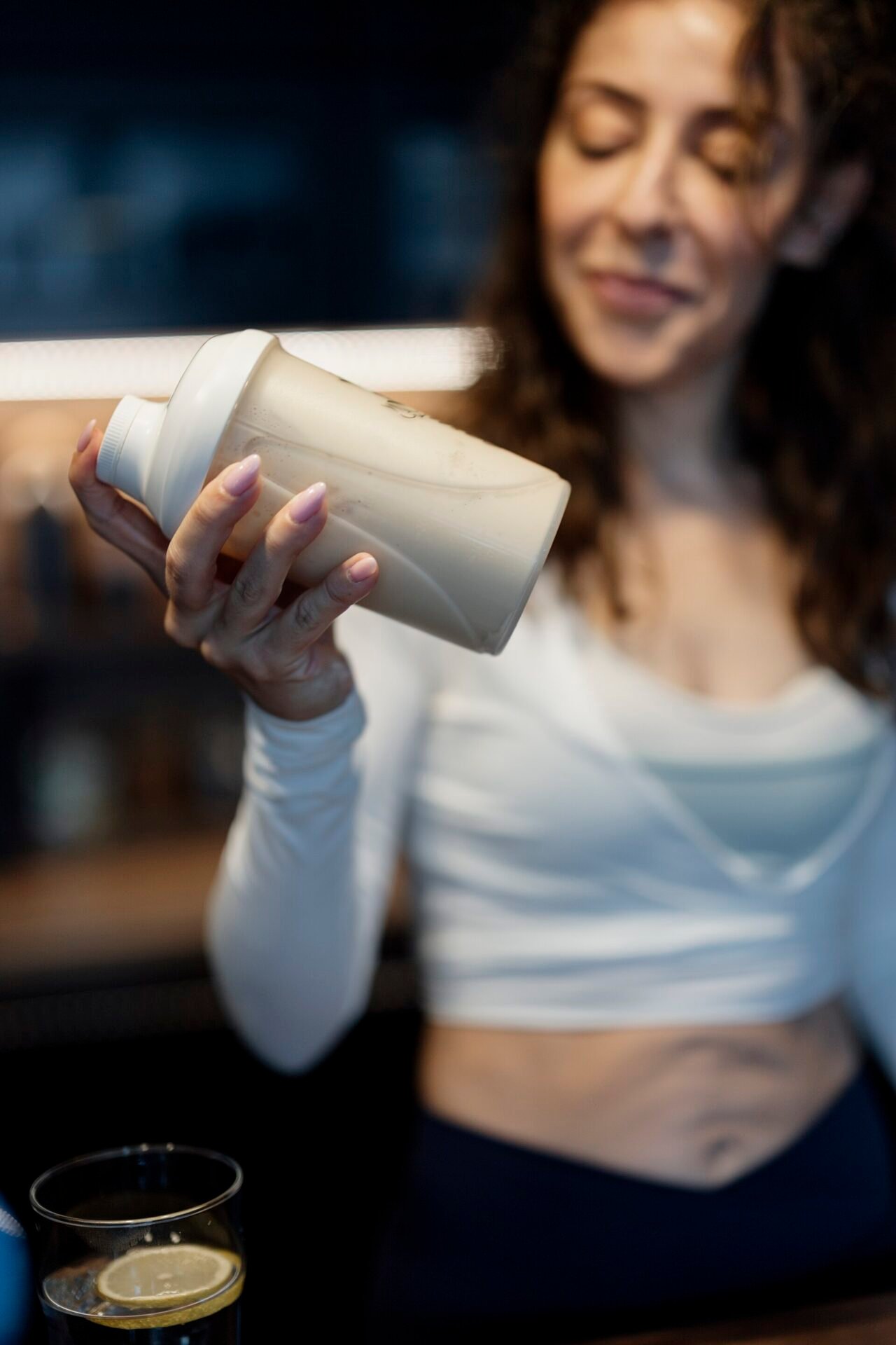 Close-up of a protein shake being shaken in a shaker bottle