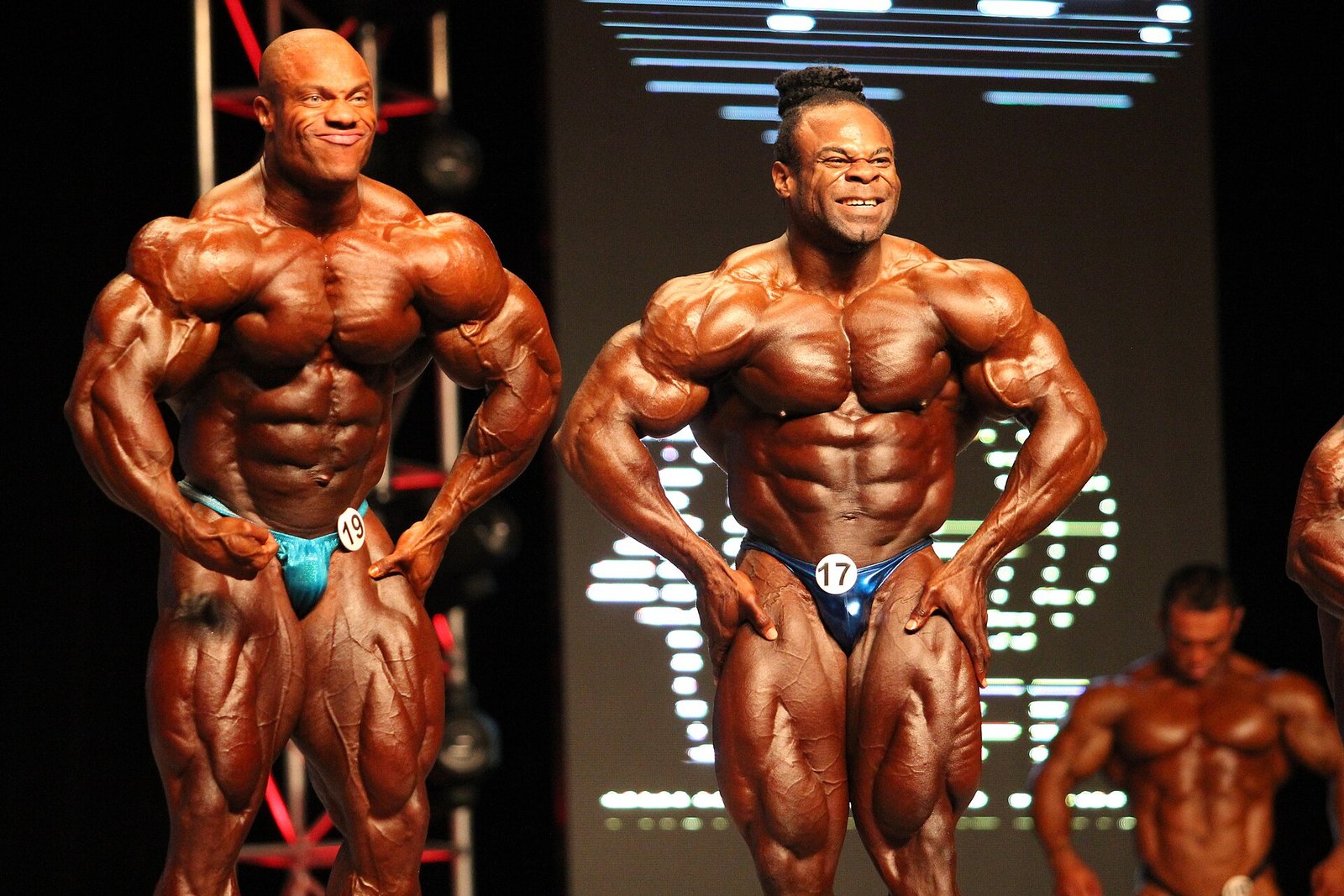 Phil Heath and Kai Greene hitting a most muscular pose at the 2012 Mr. Olympia
