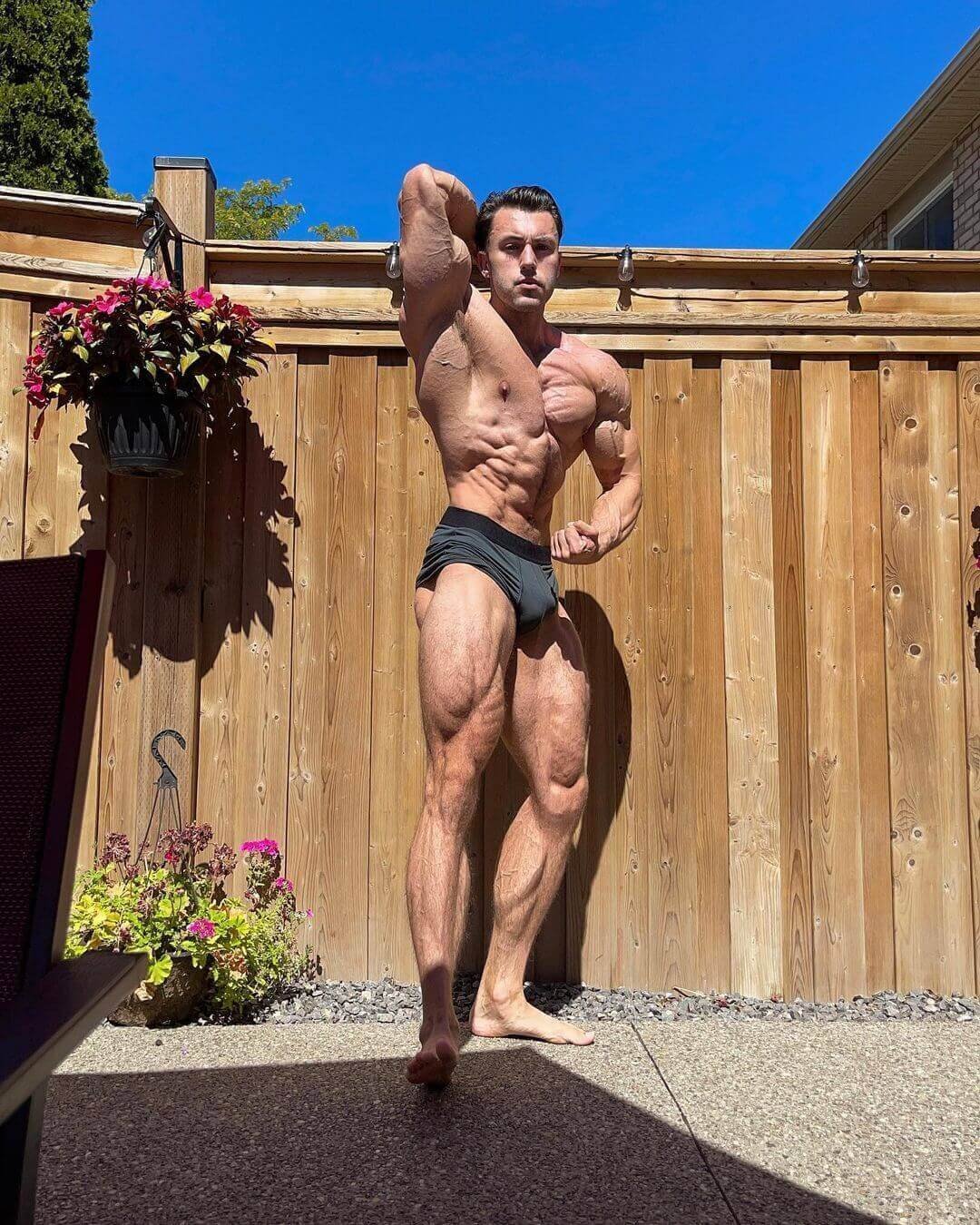 Brandon Harding in a classic physique side pose