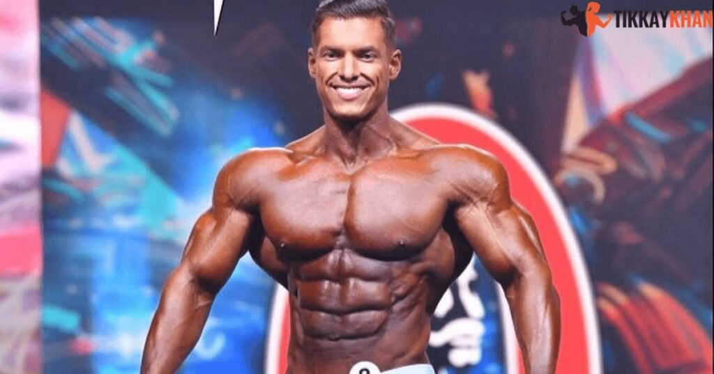 Carlos Deoliveira on stage in a Men's Physique contest