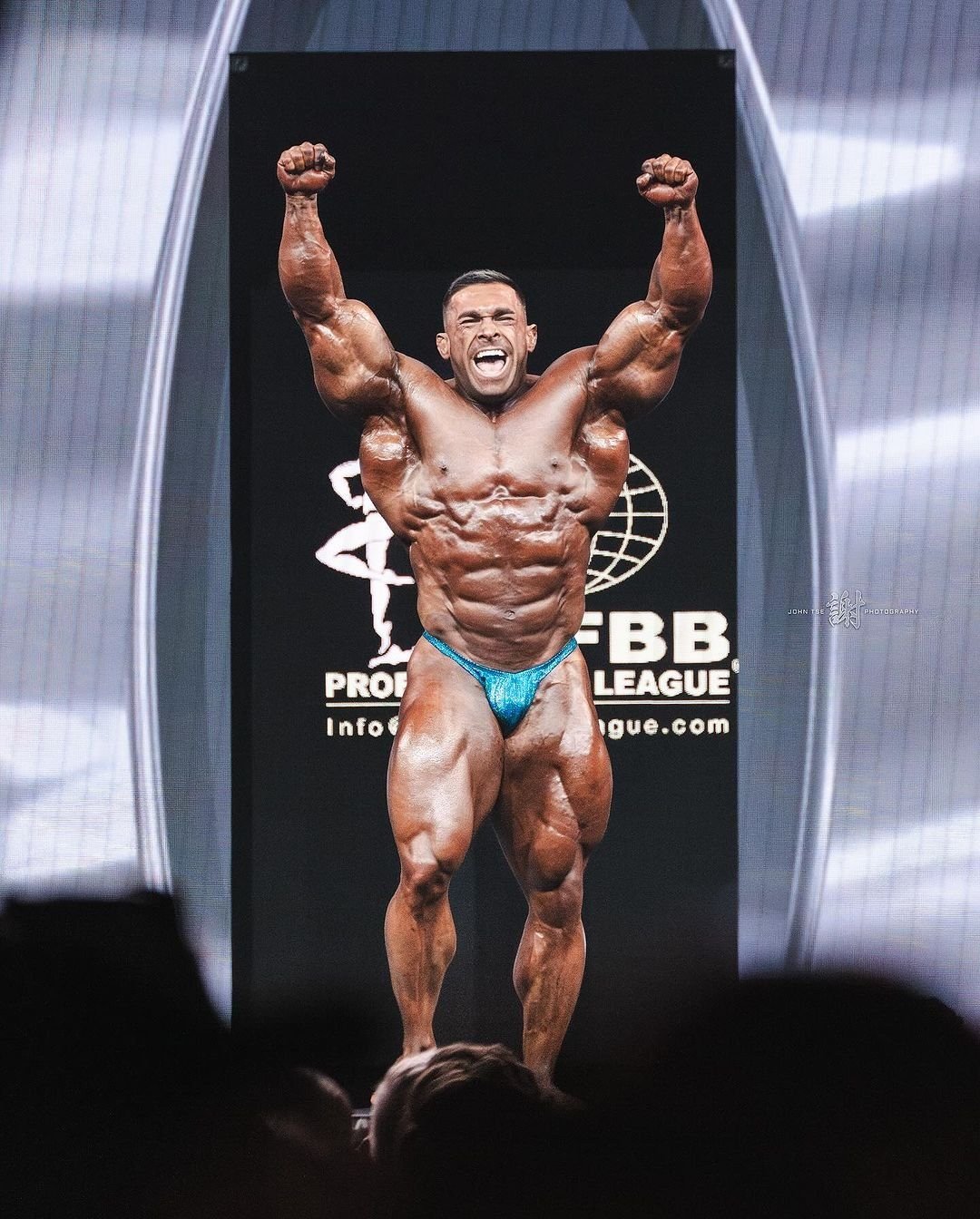 Derek Lunsford posing on the pro stage