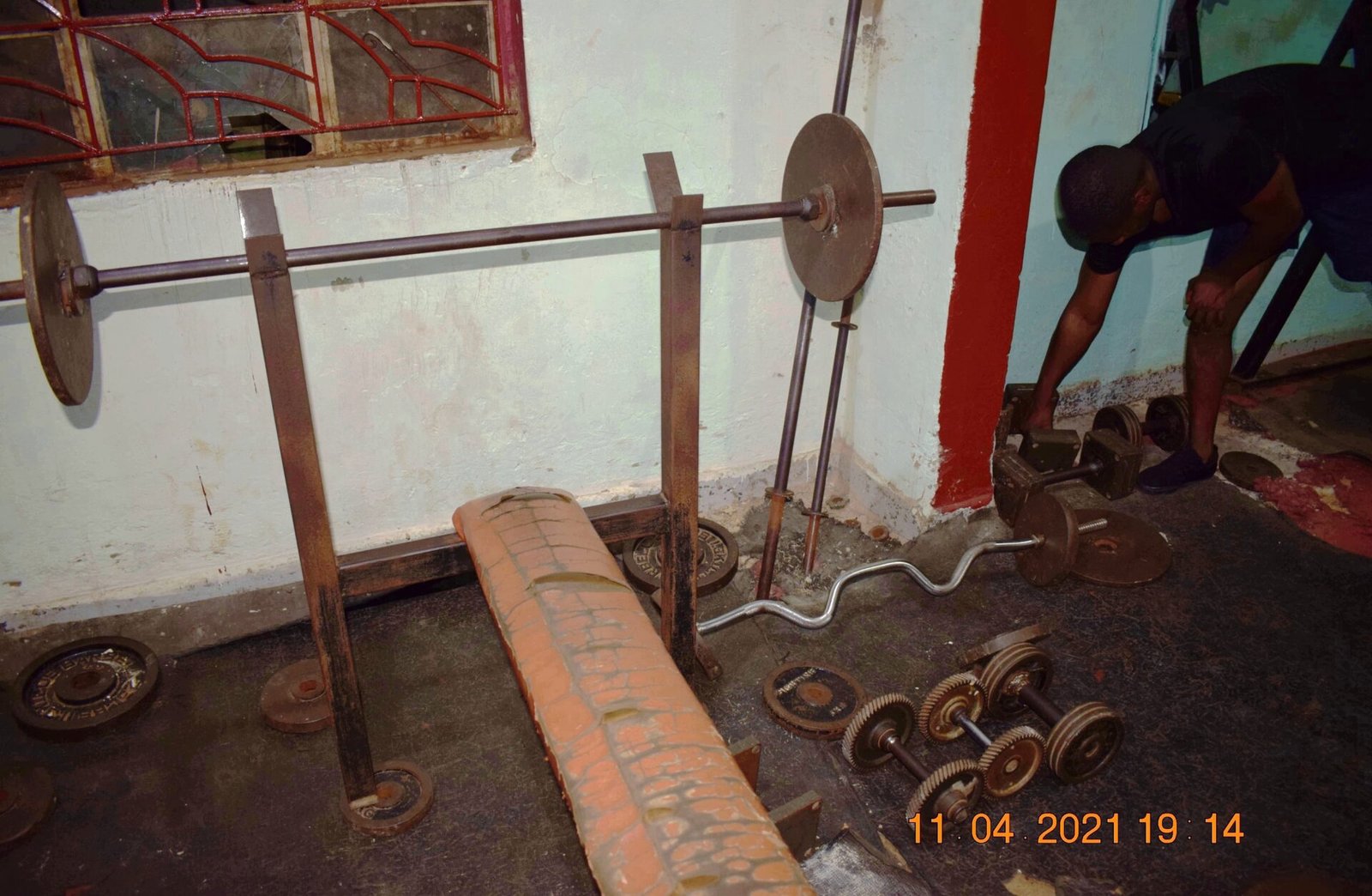 Barbell and dumbbells in a gym
