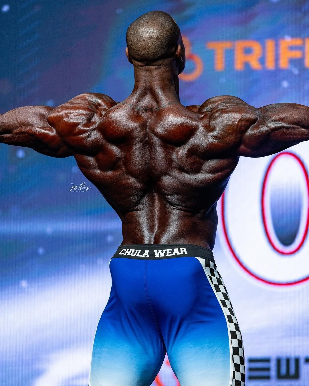 Erin Banks back pose at the Mr. Olympia