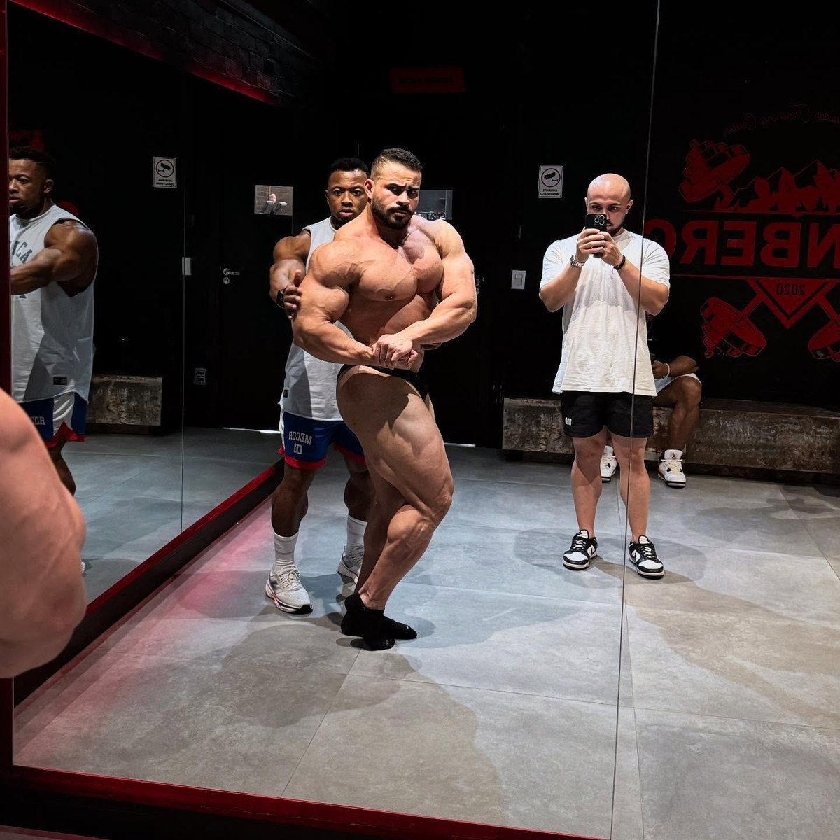 Fabio Junio practising posing in the gym