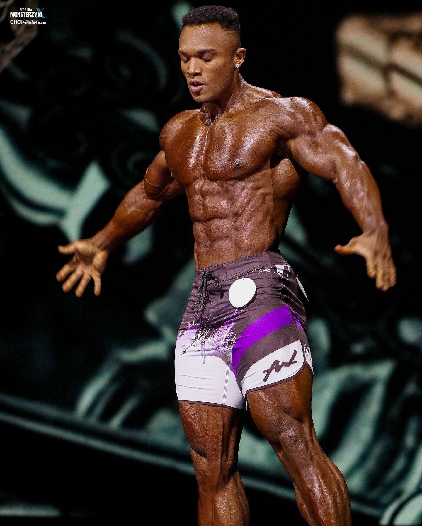 Farouq Ishimoto posing on stage at the 2025 World of Monsterzym Korea Pro in Seoul