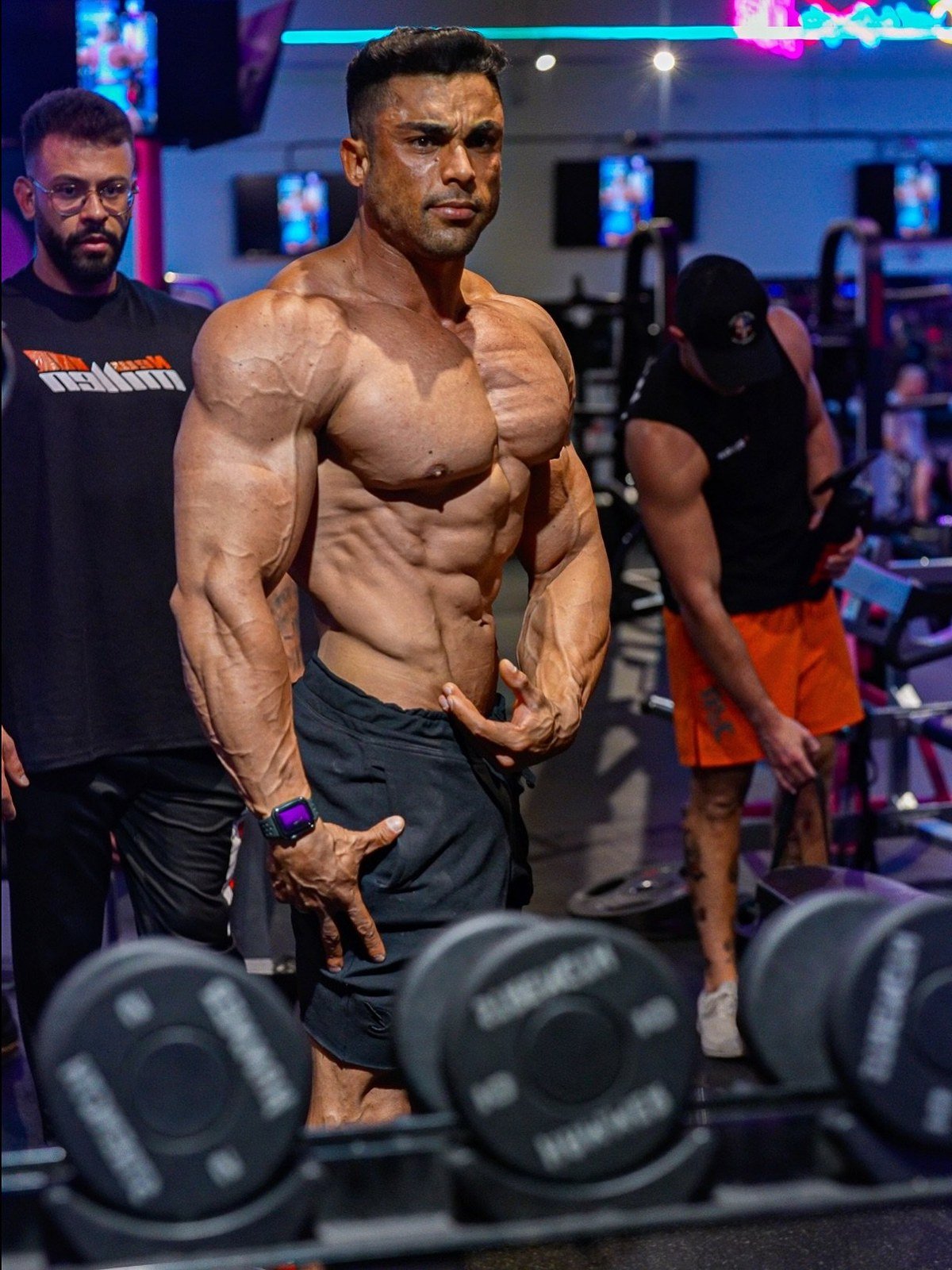 Guilherme Gualberto posing during a gym training session