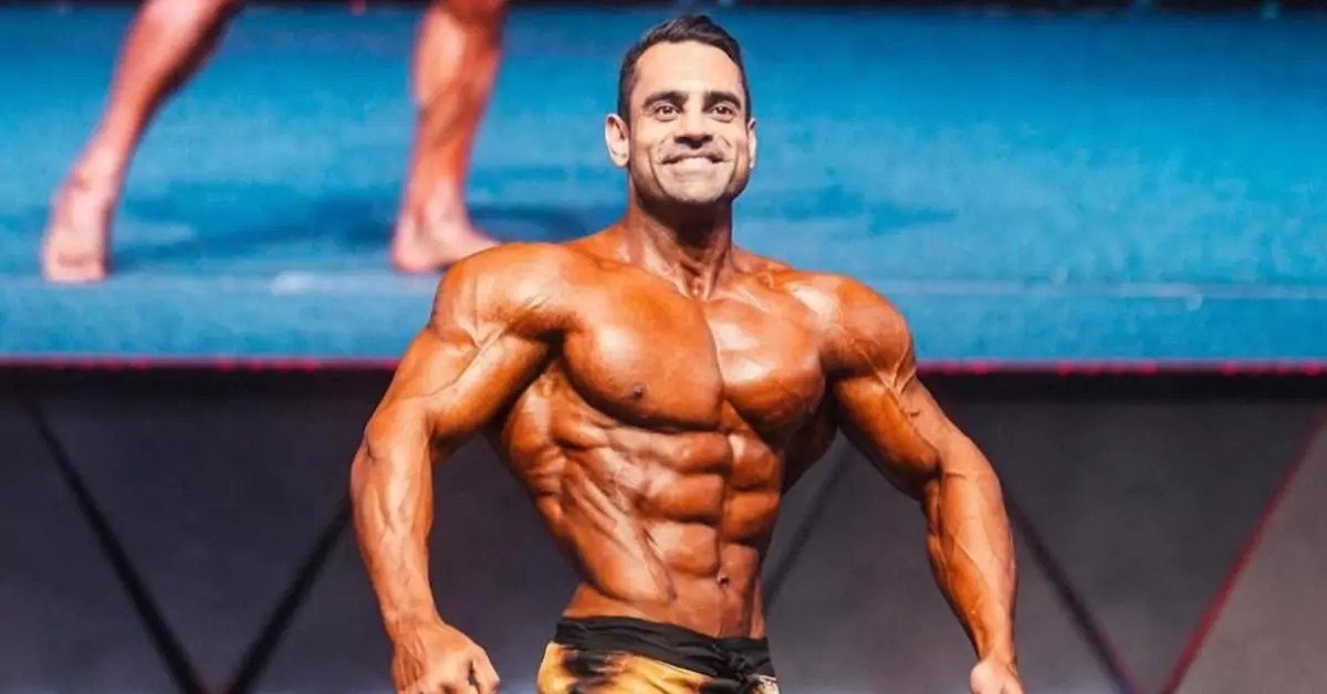 Hossein Karimi posing on stage during his breakthrough 2024 pro season