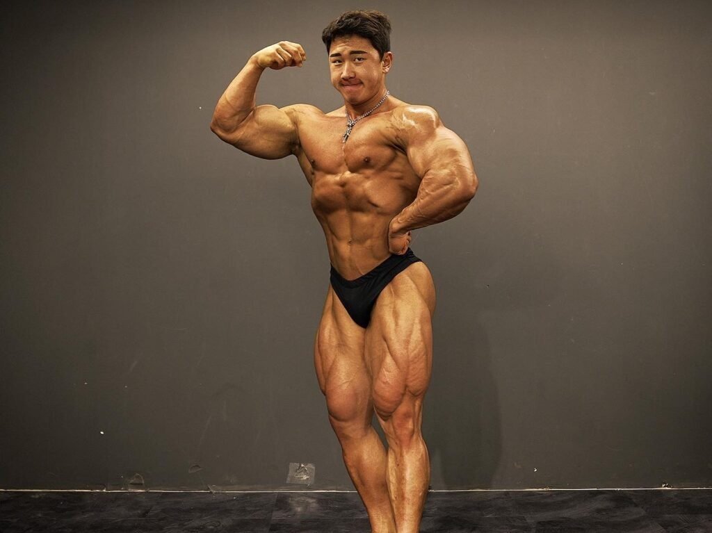 Jaehun Park posing in the gym, showing his trademark leg development