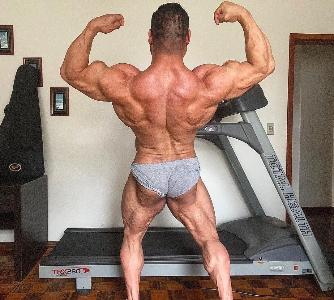 James Bondi hitting a back double-biceps pose