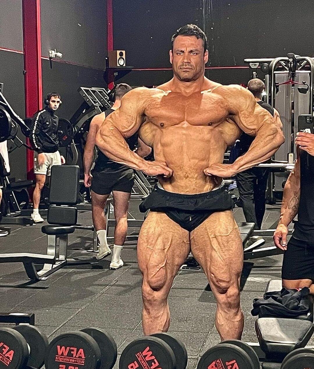 James Bondi posing in the gym with a front lat spread