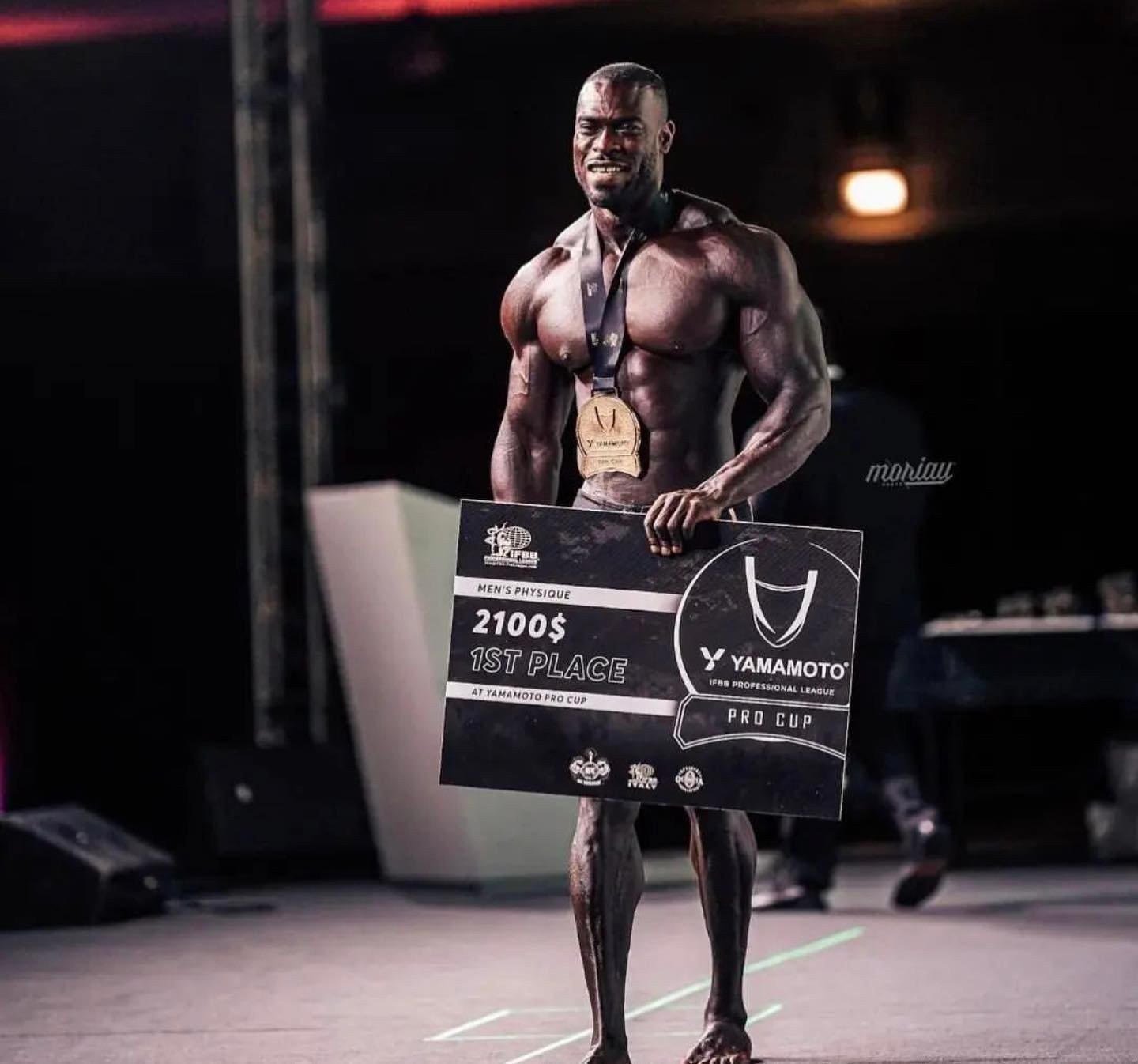 Jeffrey Darko holding the Yamamoto Pro Cup first-place board and wearing the winner’s medal