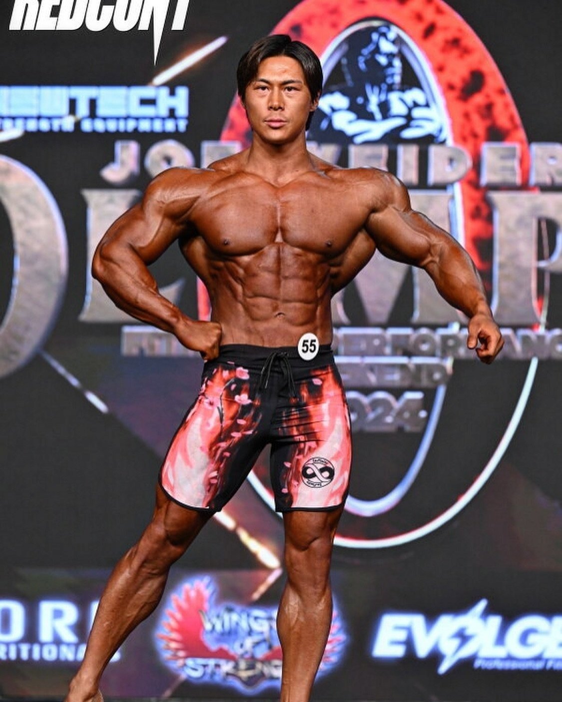 Jo Uezato posing on the Mr. Olympia stage in Las Vegas