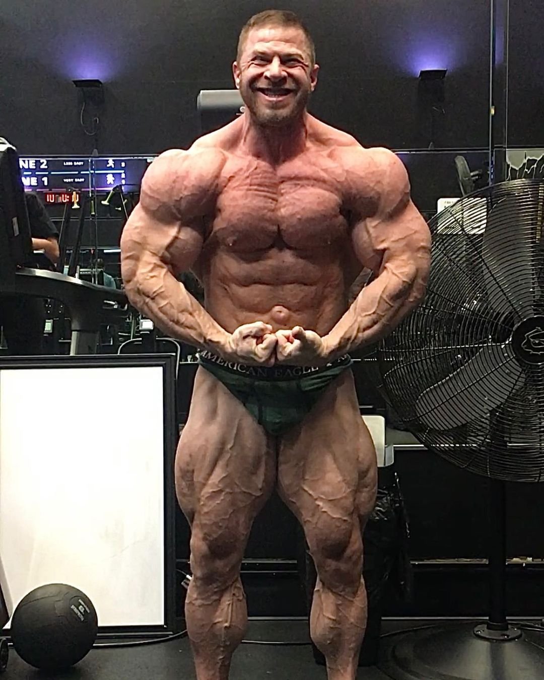 Joel Thomas posing in the gym