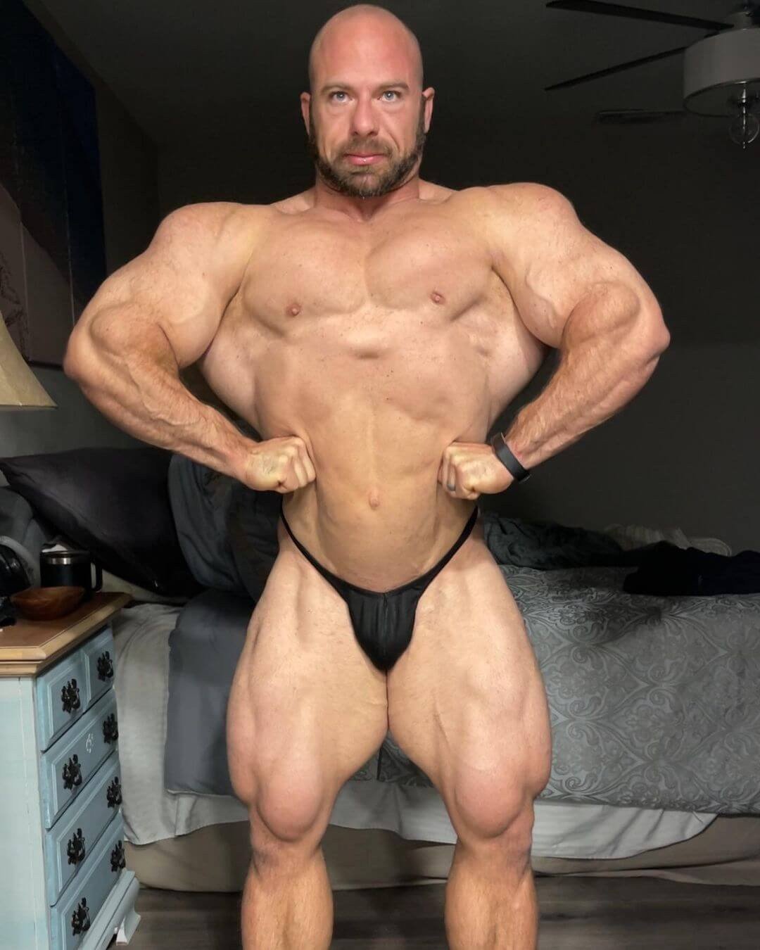 John Jewett hitting a front lat spread during an off-season check-in at home