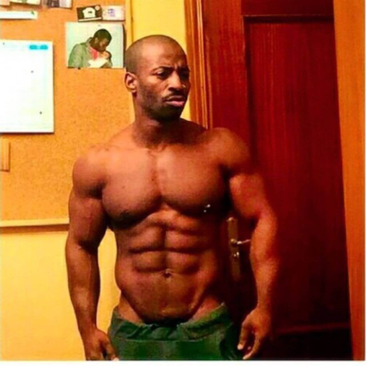 A younger Jose María Mete Bueriberi shirtless indoors, showing his early physique