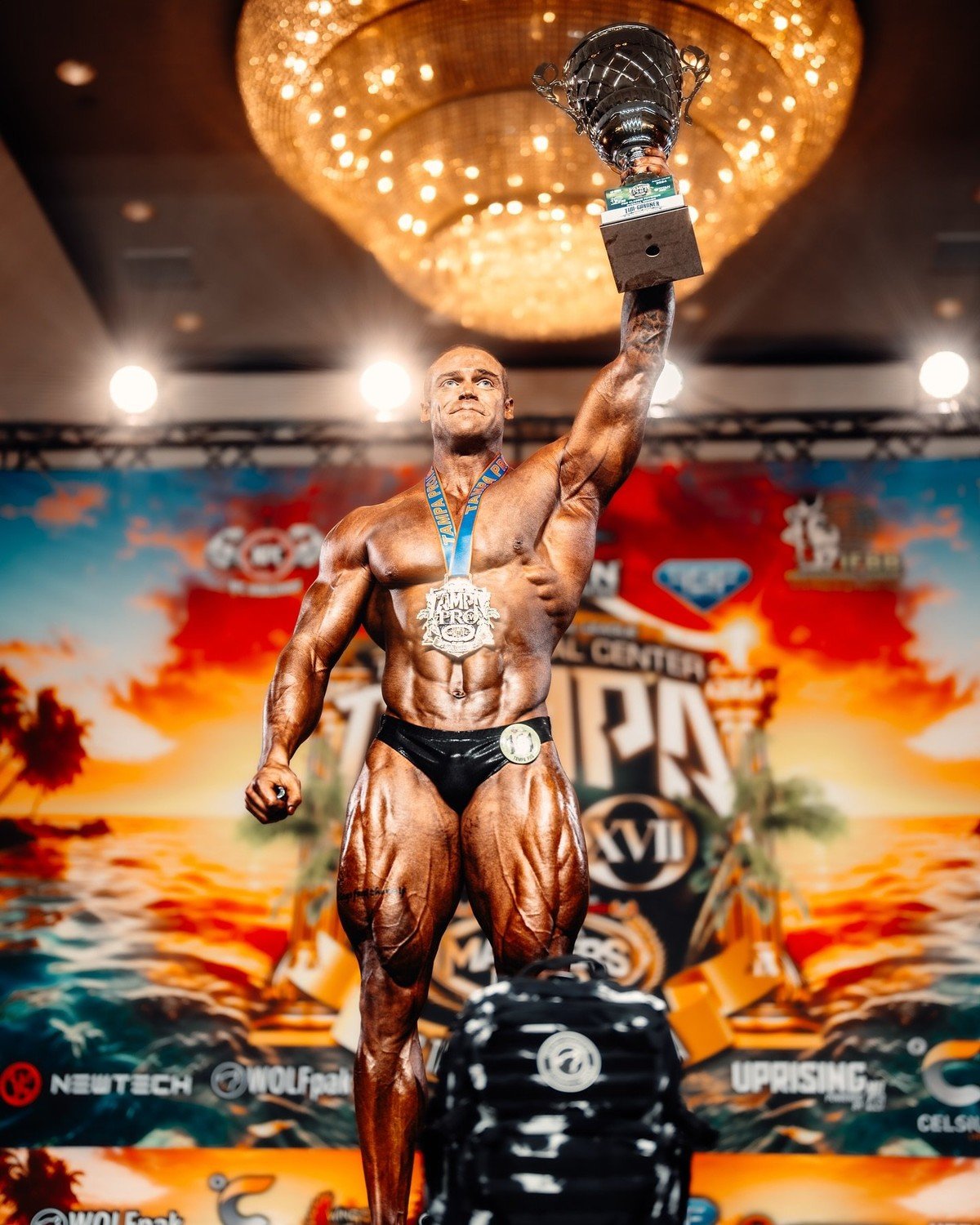 Justin Badurina holding the Tampa Pro trophy after his first professional win in 2024