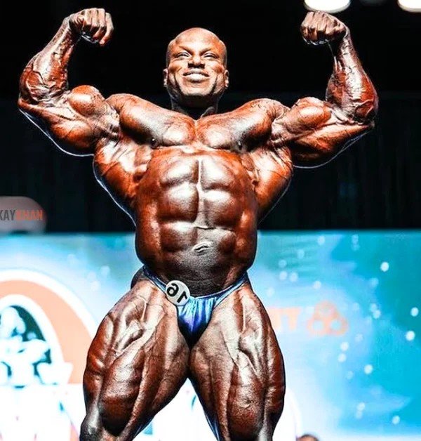 Shaun Clarida posing on stage