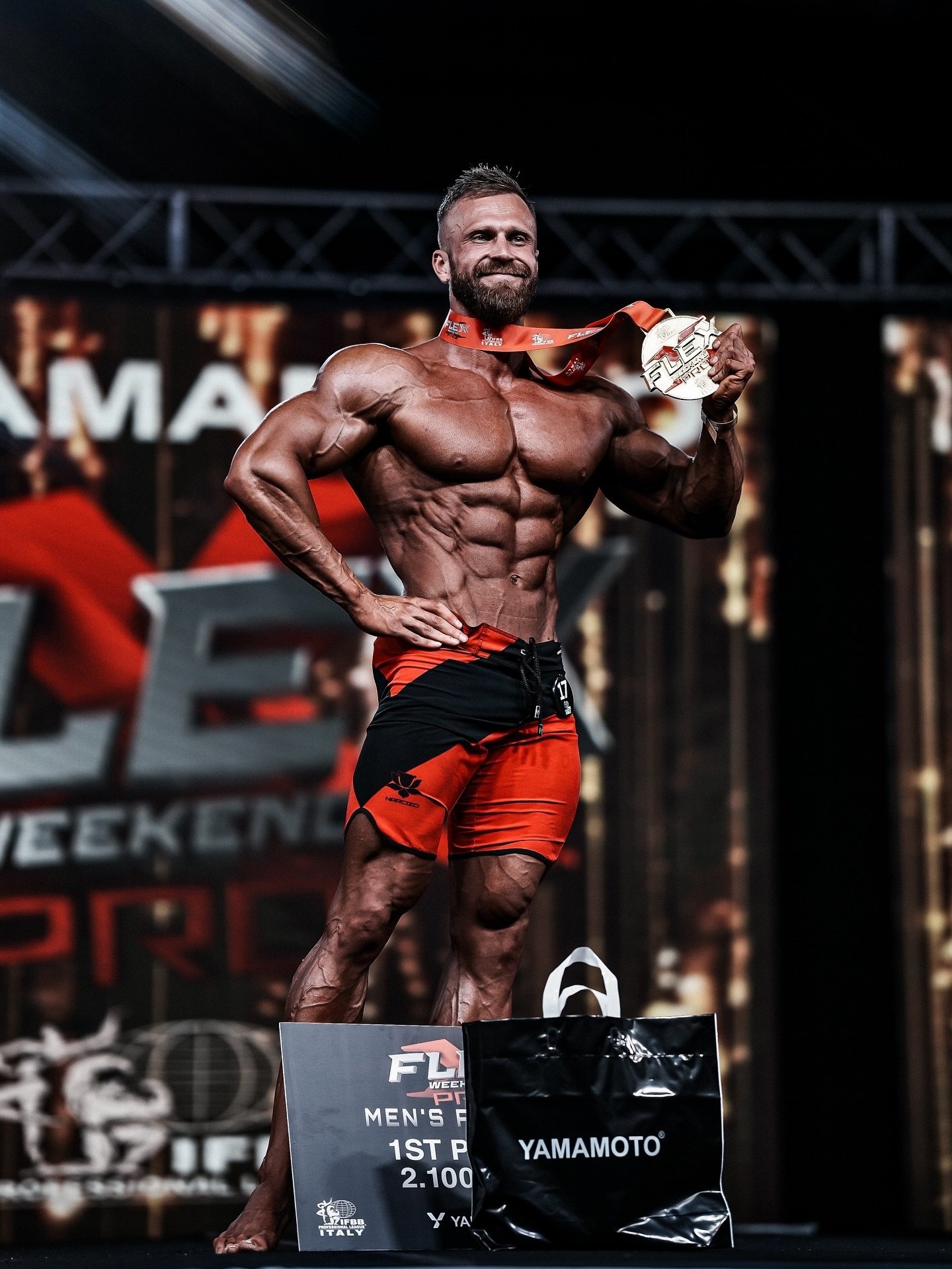 Miroslav Juríček holding his medal and first-place board after winning the FLEX Weekend Italy Pro 2025