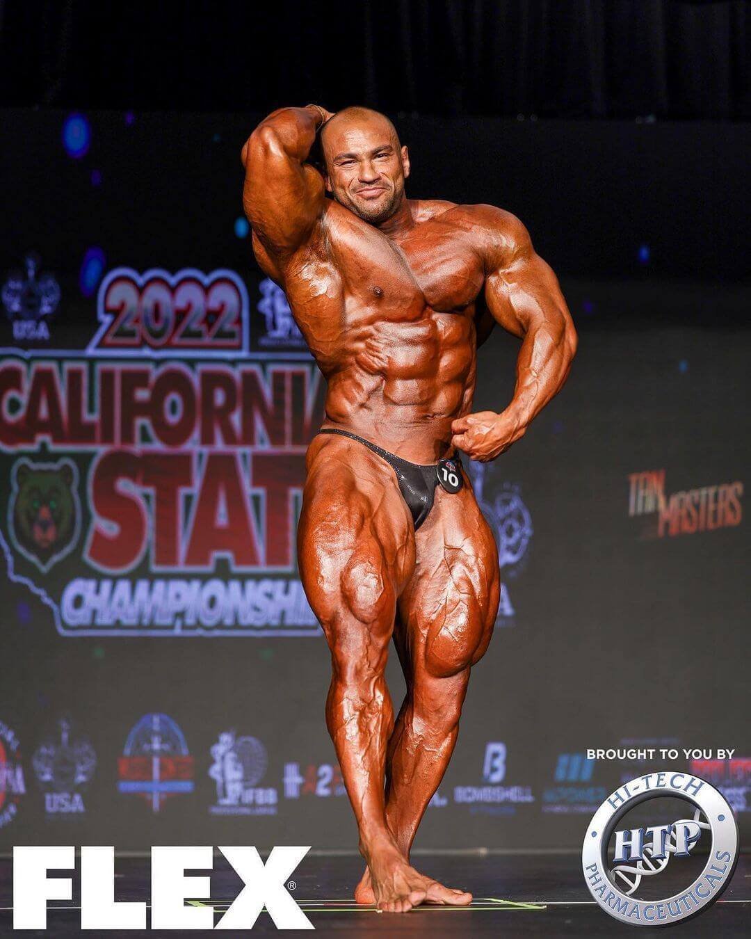 Mohamed Shaaban hitting an abdominal pose at the 2022 California State Pro