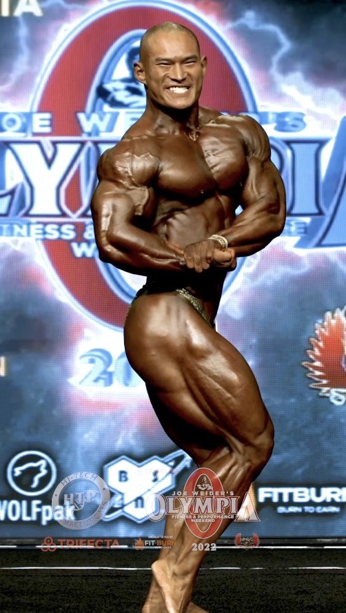 Ping Yun Long on stage at the 2022 Mr. Olympia