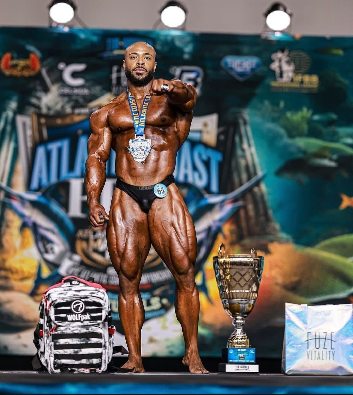 Sabur Favors with the winner's trophy and medal at the 2024 Atlantic Coast Pro