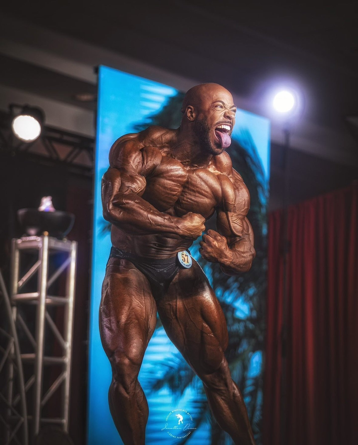 Sabur Favors hitting a side chest pose at the 2024 Hurricane Pro