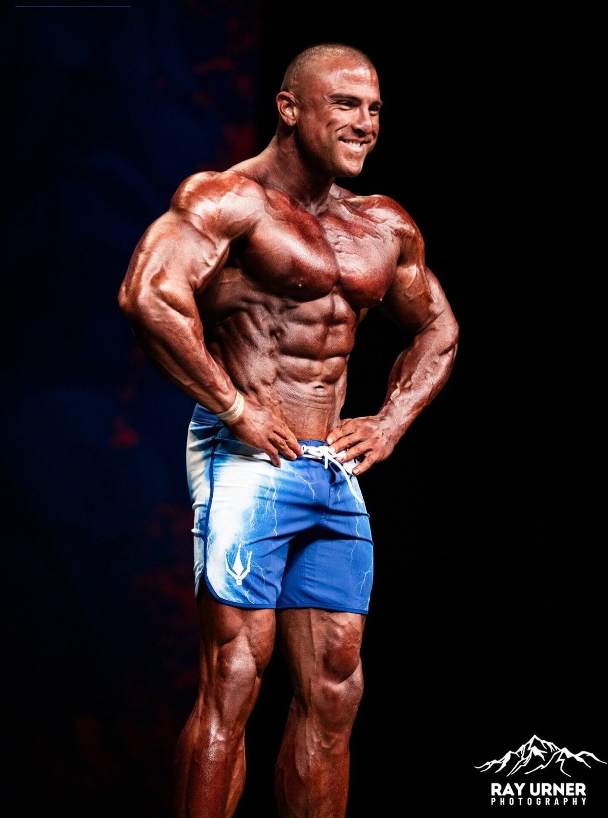 Sotiris Gatsis hitting a side pose on stage in 2025