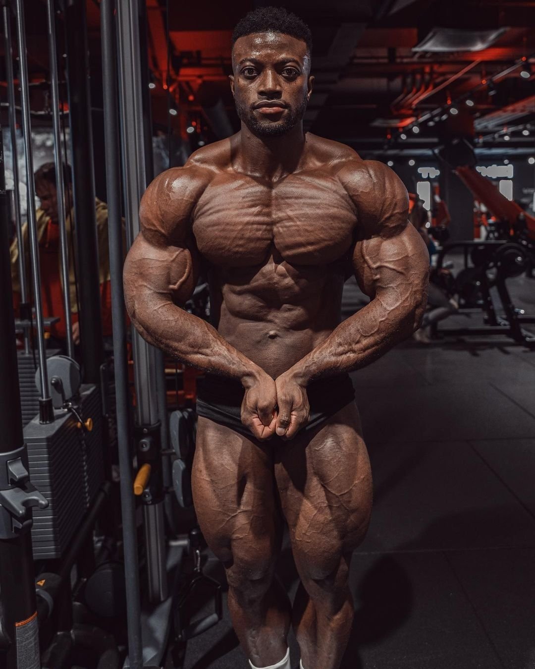 Stephane Matala in a front relaxed pose in the gym