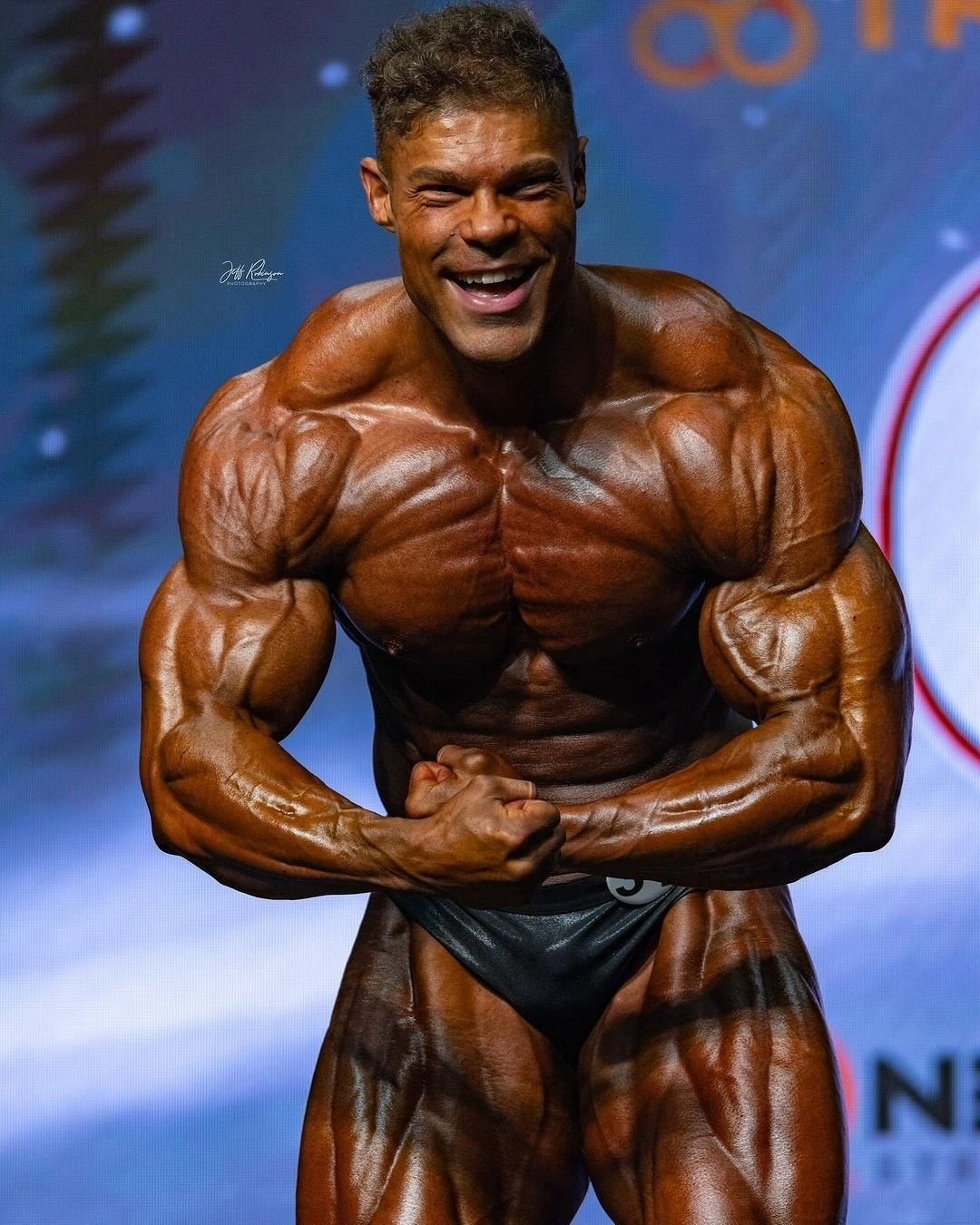 Wesley Vissers hitting a most muscular pose on the Olympia stage